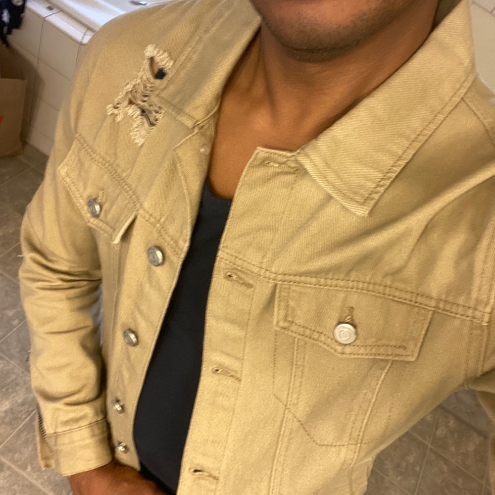 Forever 21 Mens Ripped Trucker with sleeve and side zippers.